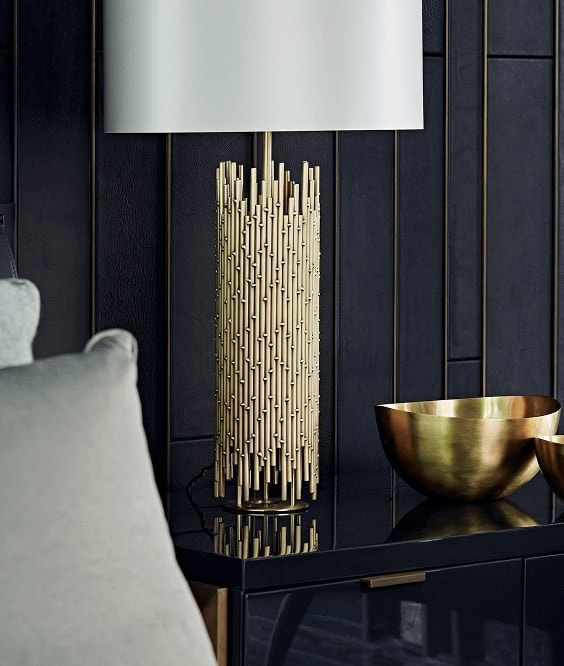Brass table lamp and gilded bowl on a lacquered console